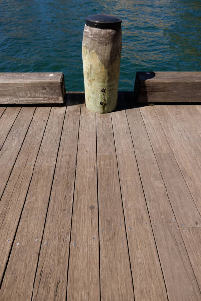 istock Wooden mooring post on a pier 1355021664