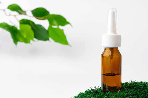 istock Cosmetics in a bottle, essential oil on moss 1355023922