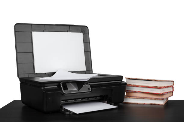 istock Office table with laser printer and books against white background 1355025035