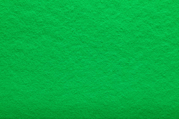 istock shaggy surface. Fine grain felt green fabric. artificial grass. fleecy texture background 1355025866
