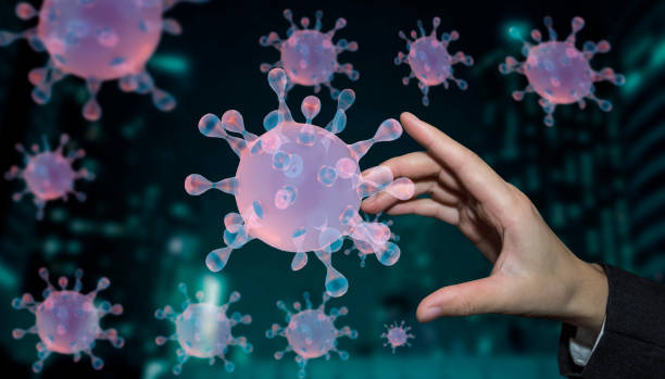 istock hand and corona virus. 1355028243