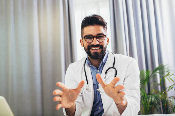 istock Doctor posing, looking at camera in his office 1355029666