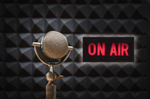 istock Professional microphone and on air sign 1355030032