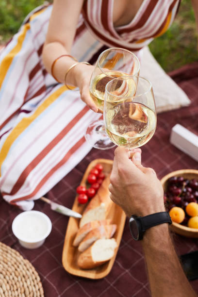 istock Couple at Romantic Picnic Outdoors Close Up 1355031568