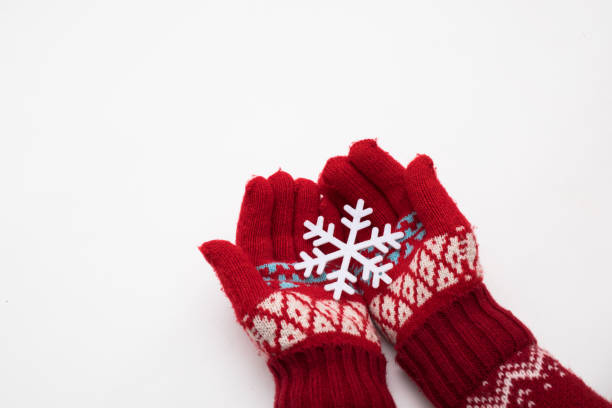 istock Woman hand with chrismas toy isolated on white 1355032011