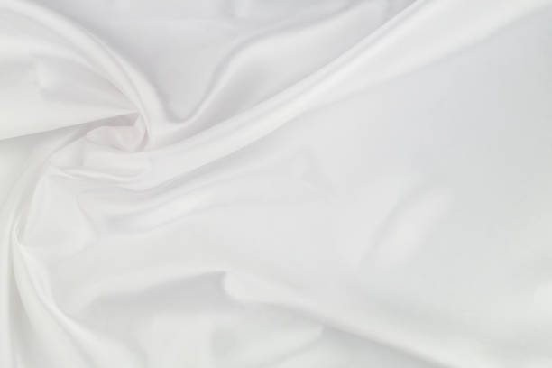 istock White satin or silk fabric as background. 1355033991