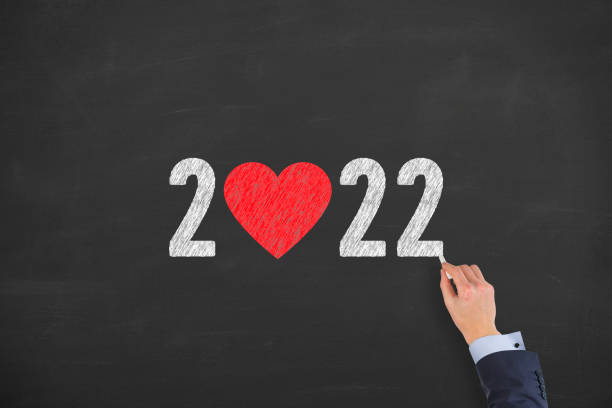 istock New Year 2022 with Heart Shape on Chalkboard Background 1355034350