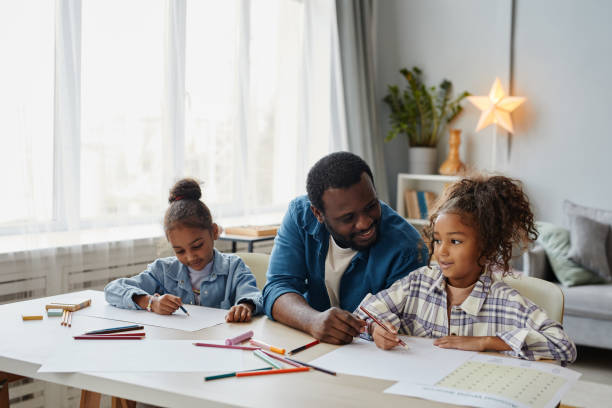 istock Father with Two Girls 1355034433