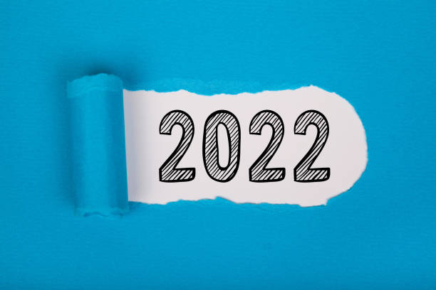 istock Torn Paper With Happy New Year 2022 On White Background 1355035555
