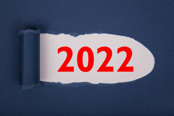 istock Torn Paper With Happy New Year 2022 On White Background 1355035865