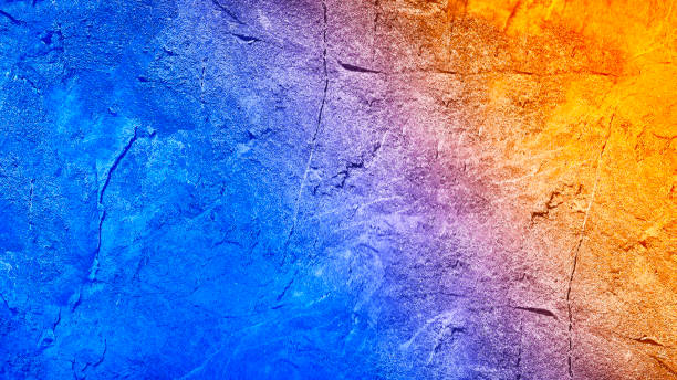 istock Blue orange yellow abstract background. Toned rock texture background with copy space for design. 1355036428