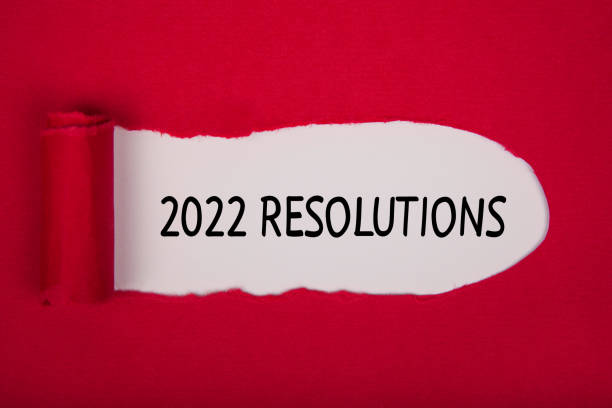istock Torn Paper With New Year 2022 Resolutions On White Background 1355036801