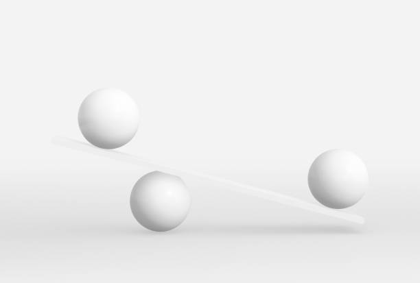 istock Round shape unbalancing on plank board isolated on white. 1355036879