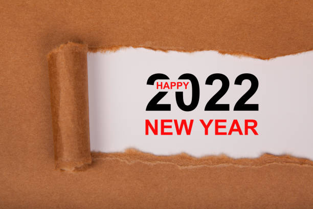 istock Torn Paper With Happy New Year 2022 On White Background 1355037645
