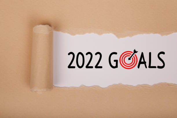 istock Torn Paper With New Year 2022 Goals On White Background 1355037933