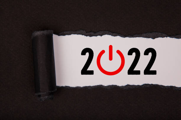 istock Torn Paper With New Year 2022 Start Up Concepts On White Background 1355038070