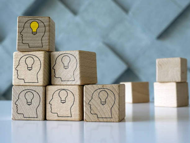istock Leadership and new ideas concept. Cubes with head shapes. 1355038808