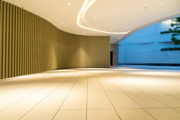 istock empty ground floor in front of modern office building exterior. 1355040114