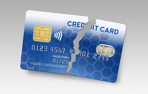 Broken credit card isolated on background