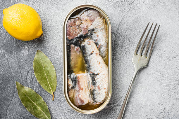 istock Sardines can preserve, on gray stone table background, top view flat lay 1355040656