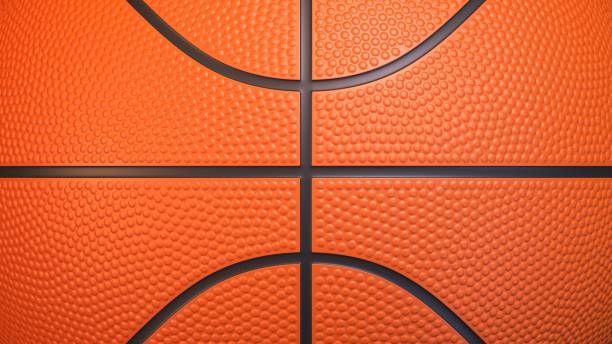 istock Orange basketball ball surface background 1355041995