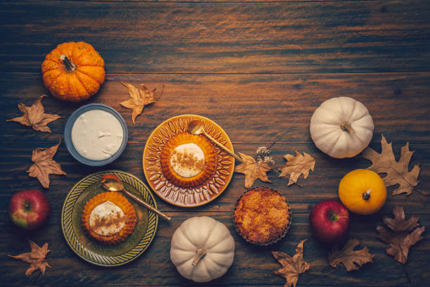 istock Homemade small pumpkin pies with icing for Thanksgiving 1355042087