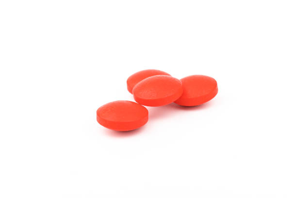 istock Red pills on a white background, isolated. Pharmacy. Treatment. 1355044929