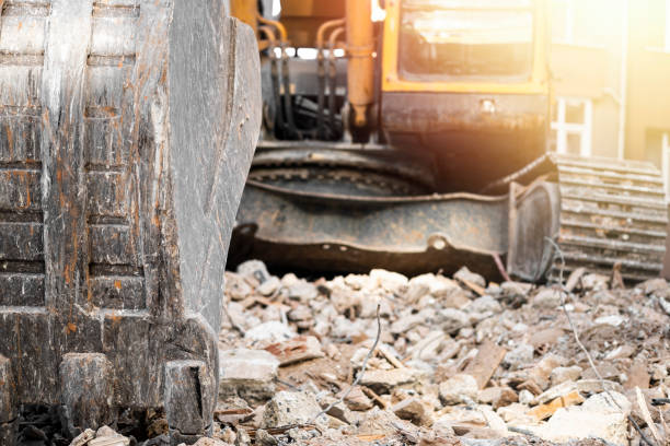 istock Hydraulic crusher excavator backoe machinery working on site demolition 1355045619