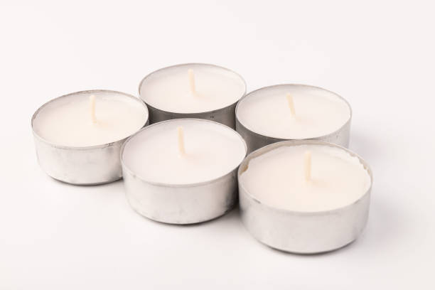 istock Many wax candles together on the white background. Space for text 1355045981