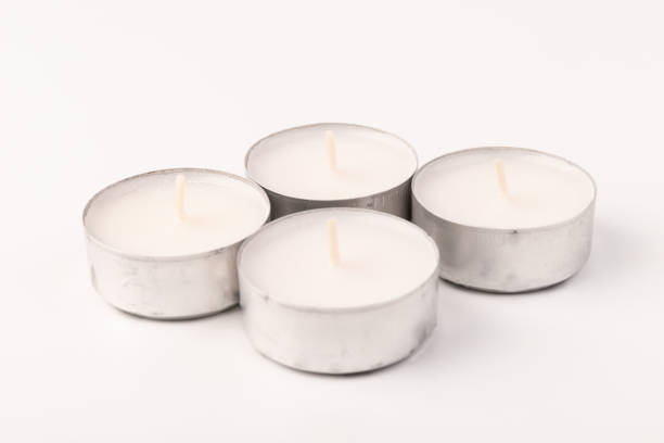 istock Many wax candles together on the white background. Space for text 1355045992