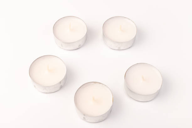 istock Many wax candles together on the white background. Space for text 1355046019