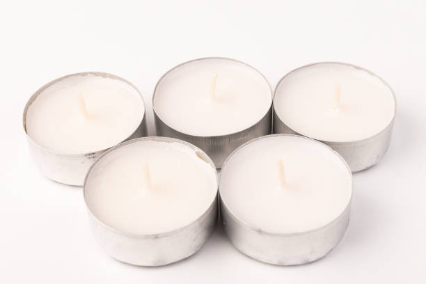 istock Many wax candles together on the white background. Space for text 1355046023
