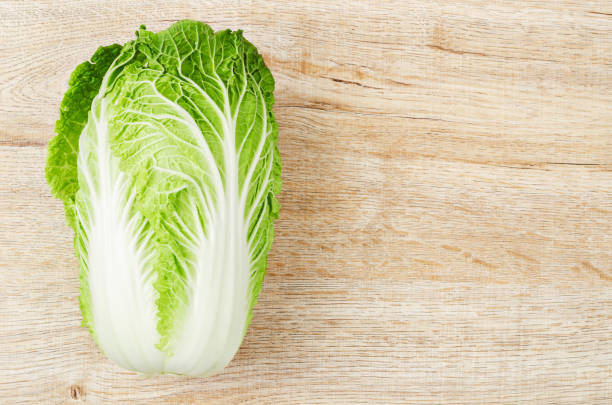 istock Fresh chinese cabbage on wooden background 1355046391