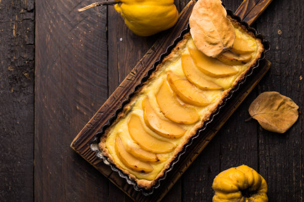 istock quince tart with custard open and shortcrust pastry and cinnamon. 1355048968