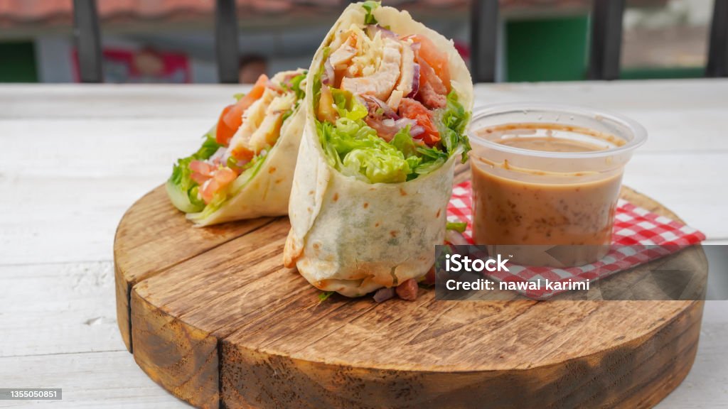 Wrap salad Delicious Breaded Chicken in a Tortilla Wrap in selective focus Wrapping Paper Stock Photo