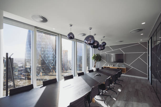istock Wide angle view of modern London board room 1355051088