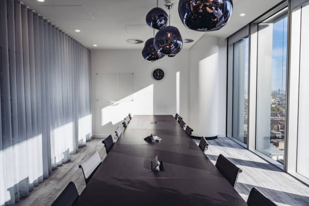 istock Sunlit board room in modern office 1355051089
