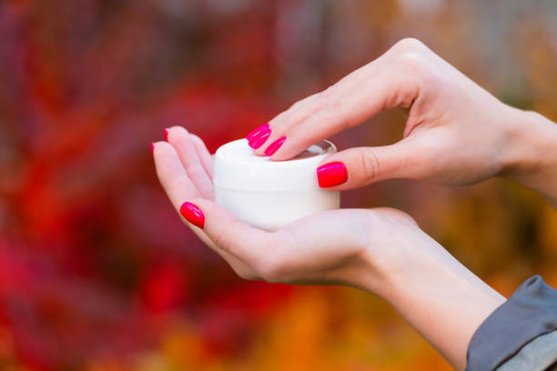 istock hand open shampoo bottle on colorful background, morning 1355051229