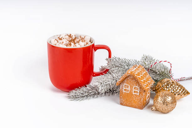 istock Christmas cocoa mug with marshmallow on a white background with gingerbread. Copy space banner 1355054126