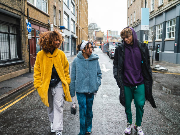istock Hip friends walking in the city 1355054545