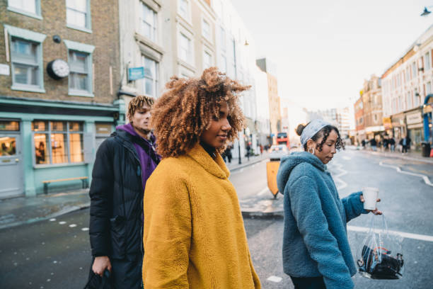 istock Hip friends walking in the city 1355054554