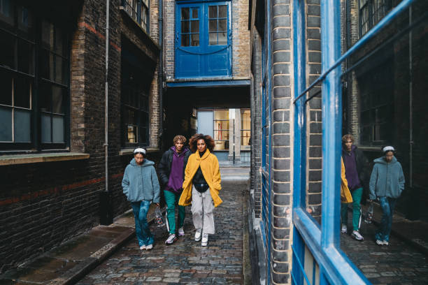 istock Three hip friends walking together in the city 1355054563