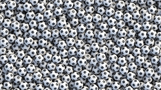 Soccer balls background. Many classic black and white football balls lying in a pile. 3d rendering