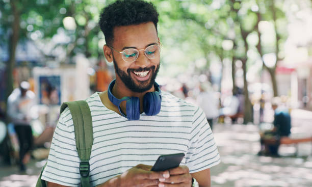 istock Shot of a young man using his smartphone to send a text message 1355055793
