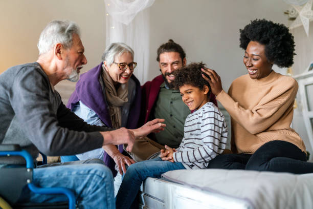 istock Three generation happy multiethnic family group at home 1355056195