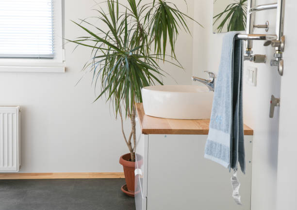 istock Modern stylish bathroom without anyone. Front view of white modern bath in contemporary apartment with stylish loft interior design, house decor. 1355056423