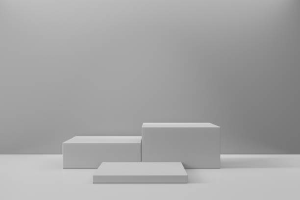 istock Cosmetic display product stand. Three gray blocks white background. 3D rendering illustration 1355060012