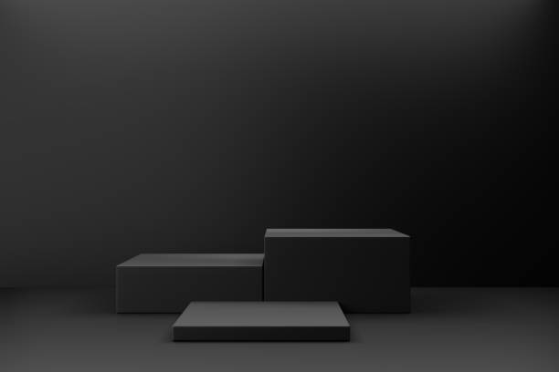 istock Cosmetic display product stand. Three black blocks on dark background. 3D rendering illustration 1355060014