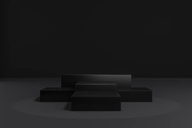 istock Cosmetic display product stand. Five black blocks on dark background. 3D rendering illustration 1355060020
