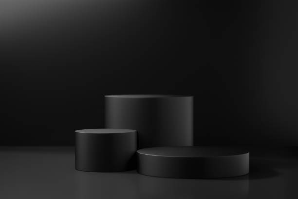 istock Cosmetic display product stand. Three black cylinder podium on dark background. 3D rendering illustration 1355060026